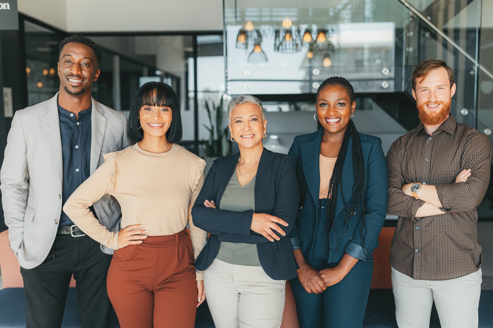 Leadership, our vision and proud business people portrait in a modern office or workplace for contact us, we are hiring or recruitment. Teamwork, diversity and happy corporate women and men smile